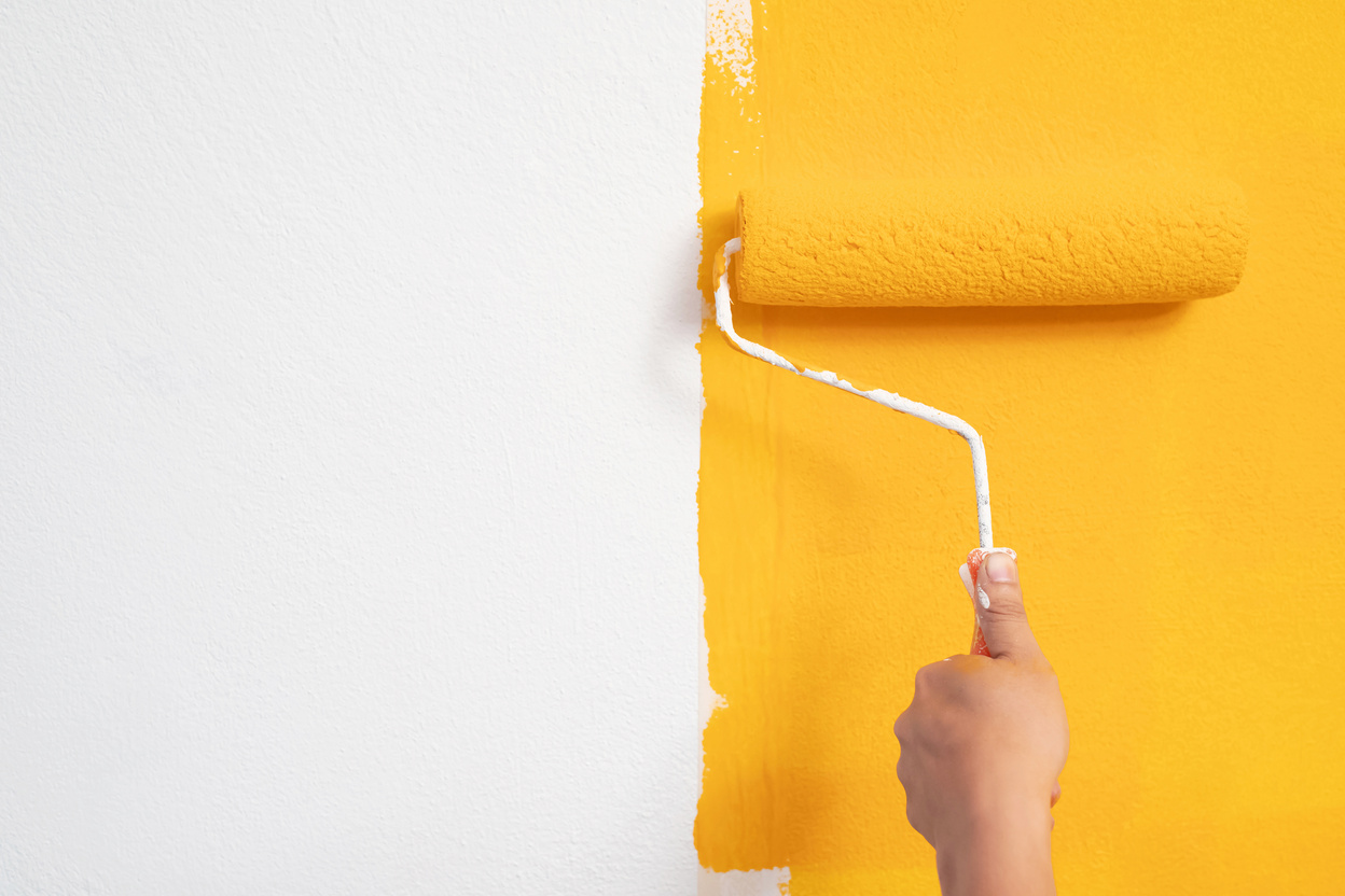 Bare Hand Painting  Wall with Yellow Paint