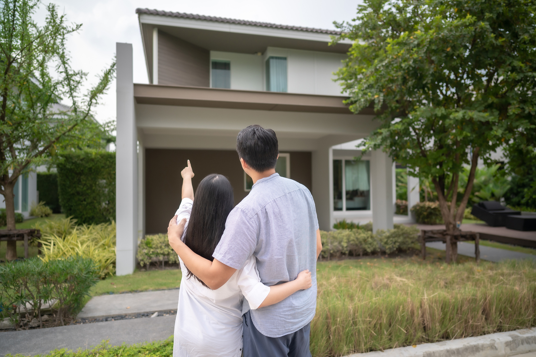 Couple in Front of New House